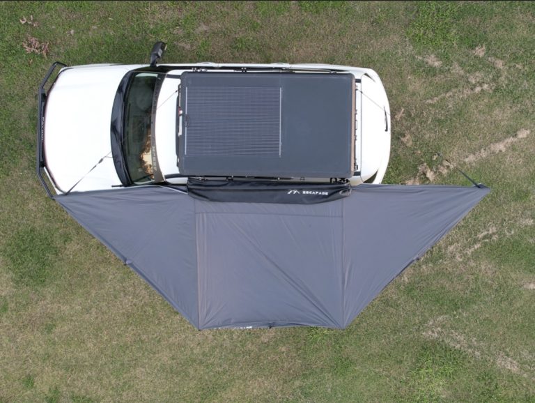 Freestanding 180-degree awning with two support poles and integrated color-changing dimmable LED lights, shown outdoors on a patio.